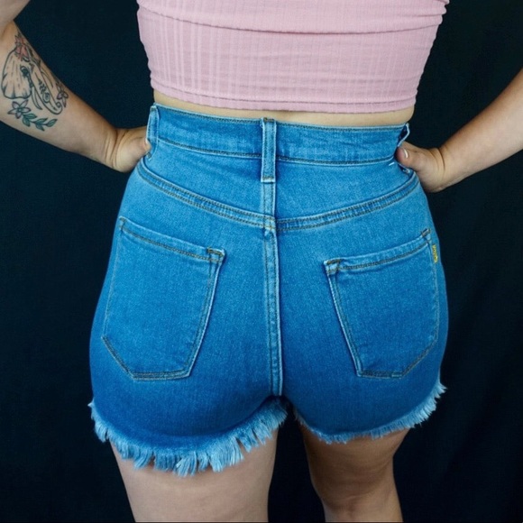 Medium wash stretch denim shorts with distressing detail - Picture 4 of 4